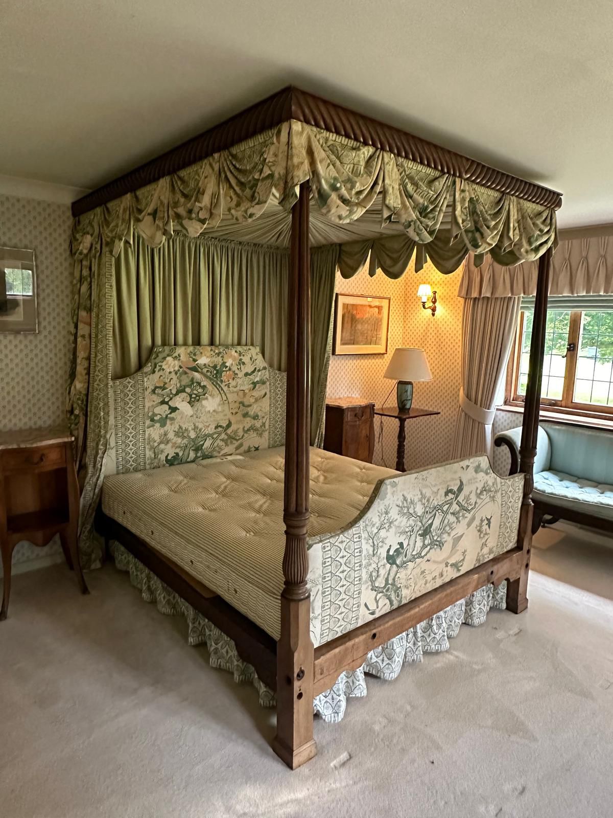 A George III style mahogany four poster bedstead